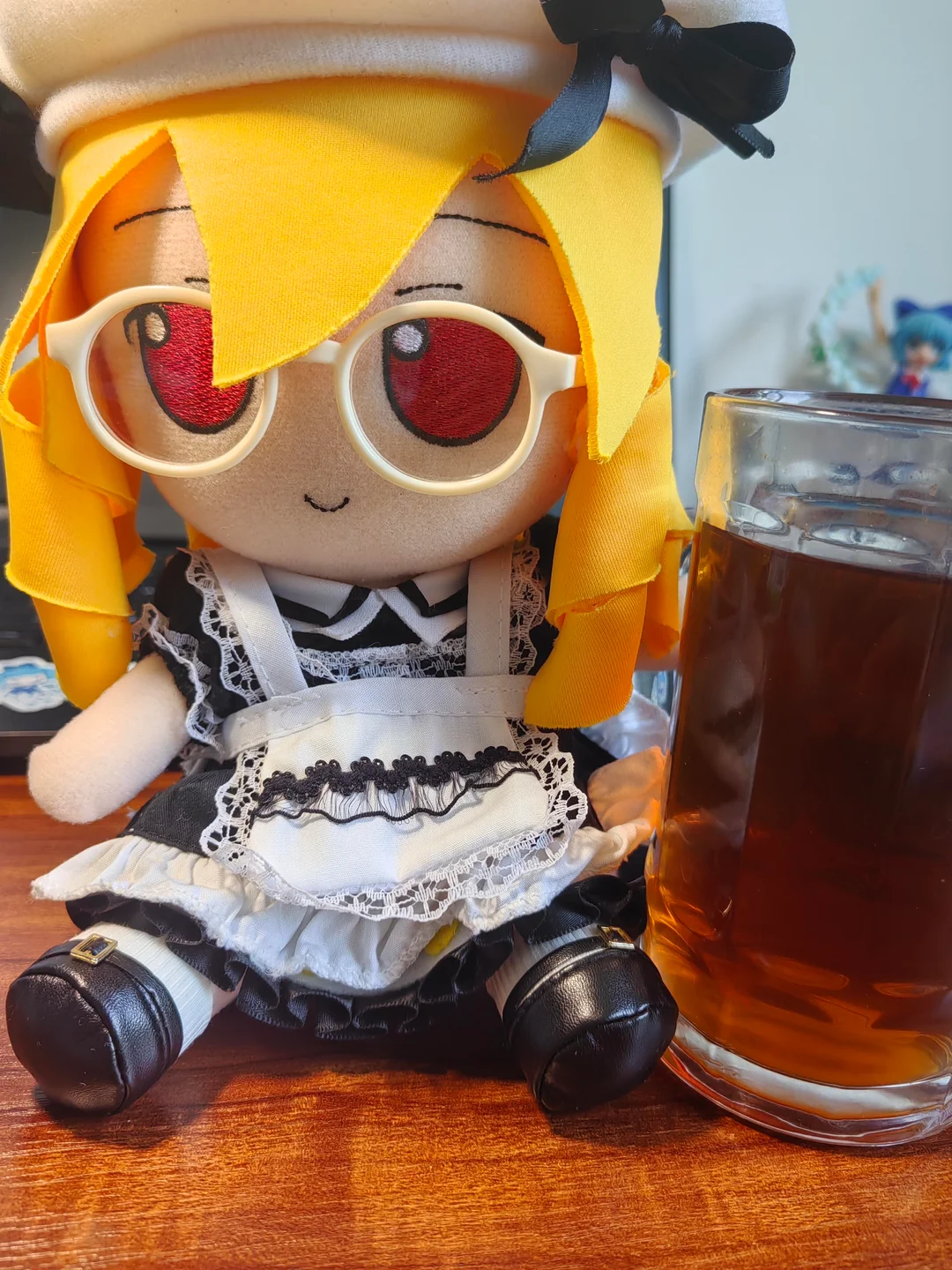 first image is a picture of a Touhou Project fumo with a glass of coffee. second image is the same fumo with a glass of coffee beans.