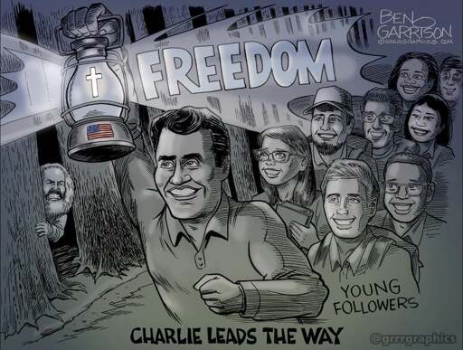 A political cartoon of Charlie Kirk, depicted as having chiseled muscles and holding a lantern, leading a group of young followers (who are labelled as such) through a dark forest. Charlie's lantern has a glowing cross inside, is branded with a US flag, and emits light containing the word "Freedom". At the bottom of the image is the text "Charlie leads the way". Karl Marx can be seen lurking behind a tree in the background shutting his eyes and grimacing in reaction to Charlie's radiant light.