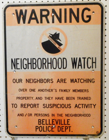 neighborhood watch sign that says the neighbors are trained to watch each other and report suspicious activities