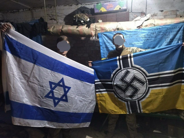 A zionist and a Ukrainian nazi present their flags side by side